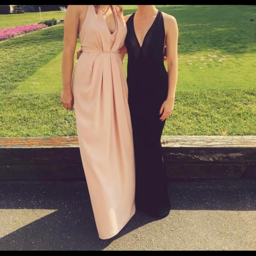 Stunning black low back gown. Inside gold. Worn once. Built in bra cups.